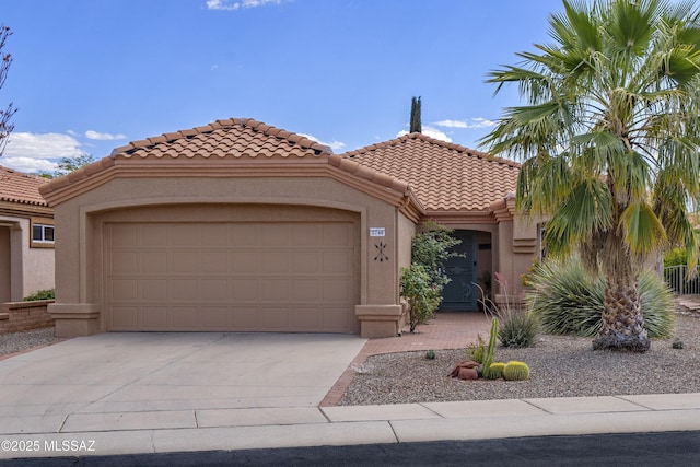 2246 E Amaranth St, Oro Valley, AZ 85755 - mediterranean / spanish-style house with a tile roof, concrete driveway, and stucco siding