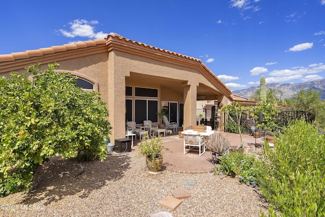 2246 E Amaranth St, Oro Valley, AZ 85755 - back of house featuring a patio area, a mountain view, stucco siding, and a tile roof