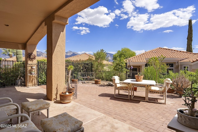 2246 E Amaranth St, Oro Valley, AZ 85755 - view of patio / terrace featuring a mountain view, outdoor dining space, and fence
