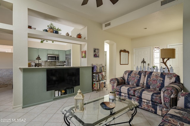 2246 E Amaranth St, Oro Valley, AZ 85755 - living area featuring arched walkways, light tile patterned flooring, and ceiling fan