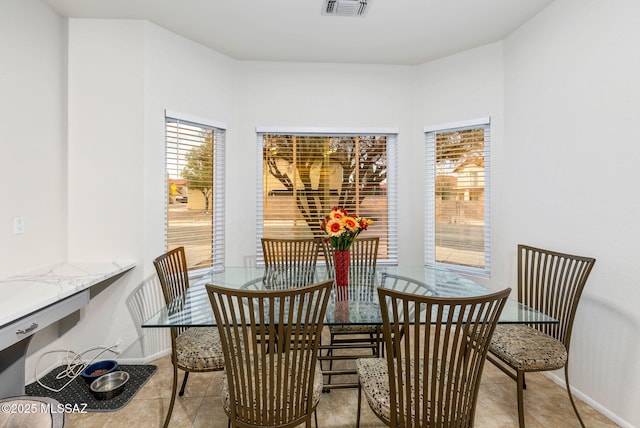 7746 S Trumpet Vine Ave, Tucson, AZ 85747 - dining space with baseboards and tile patterned flooring