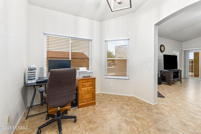 7746 S Trumpet Vine Ave, Tucson, AZ 85747 - office area featuring arched walkways, lofted ceiling, baseboards, and light tile patterned floors