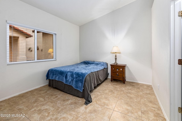 7746 S Trumpet Vine Ave, Tucson, AZ 85747 - bedroom with baseboards and light tile patterned flooring