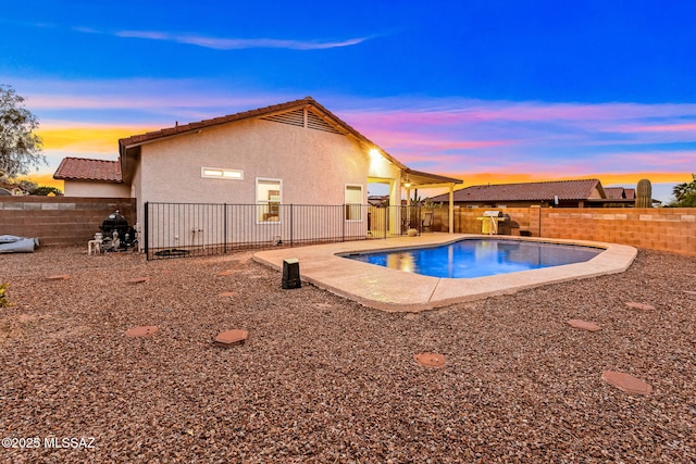 7746 S Trumpet Vine Ave, Tucson, AZ 85747 - view of pool with a fenced backyard and a patio area