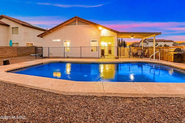 7746 S Trumpet Vine Ave, Tucson, AZ 85747 - view of swimming pool featuring fence, grilling area, and a patio