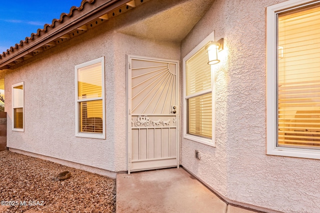 7746 S Trumpet Vine Ave, Tucson, AZ 85747 - view of exterior entry featuring stucco siding