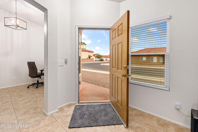7746 S Trumpet Vine Ave, Tucson, AZ 85747 - entryway with baseboards and tile patterned flooring