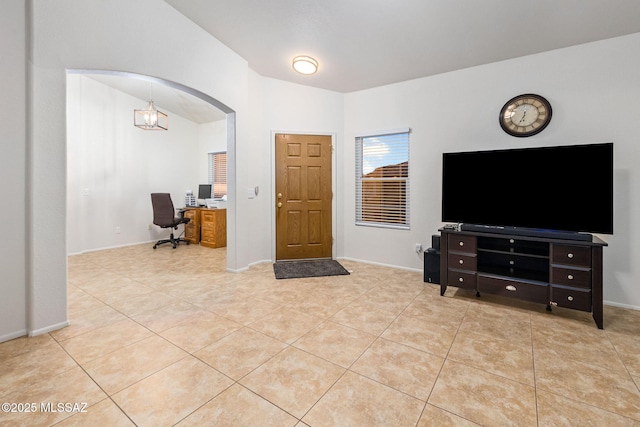 7746 S Trumpet Vine Ave, Tucson, AZ 85747 - foyer entrance with light tile patterned floors, arched walkways, and baseboards
