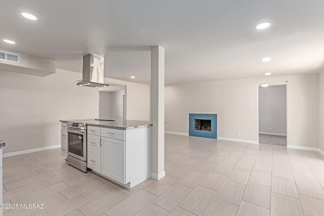 7932 E Winnepeg Dr, Tucson, AZ 85730 - kitchen with ventilation hood, stainless steel electric range, white cabinets, open floor plan, and stone countertops