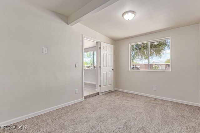 7932 E Winnepeg Dr, Tucson, AZ 85730 - empty room featuring plenty of natural light, carpet flooring, and baseboards