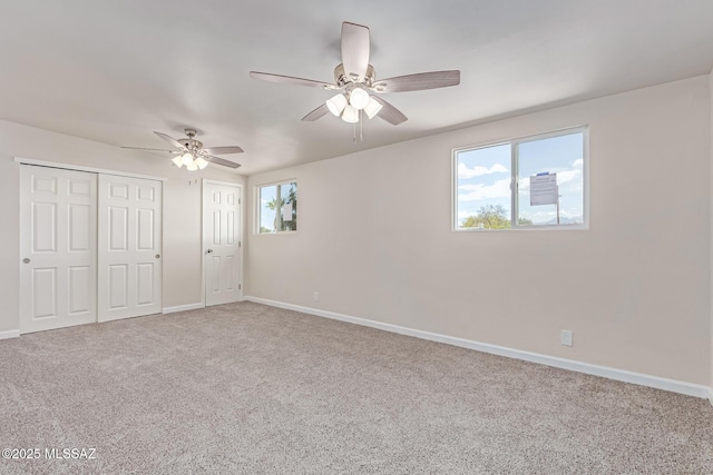 7932 E Winnepeg Dr, Tucson, AZ 85730 - unfurnished bedroom featuring carpet floors, baseboards, and ceiling fan