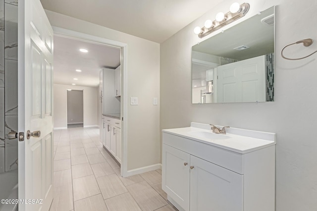 7932 E Winnepeg Dr, Tucson, AZ 85730 - bathroom with vanity, recessed lighting, and baseboards