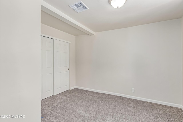 7932 E Winnepeg Dr, Tucson, AZ 85730 - unfurnished bedroom featuring carpet, a closet, and baseboards
