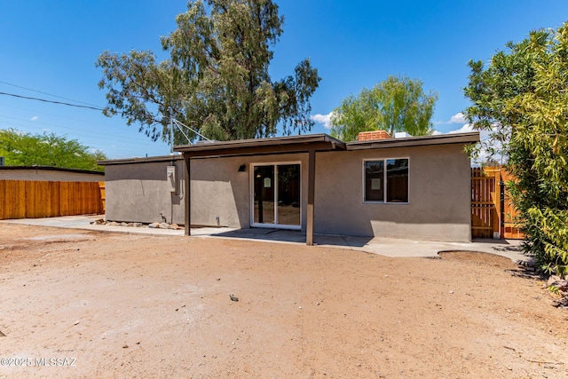 7932 E Winnepeg Dr, Tucson, AZ 85730 - rear view of property with stucco siding and fence