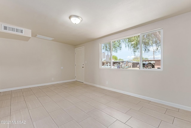 7932 E Winnepeg Dr, Tucson, AZ 85730 - spare room featuring baseboards