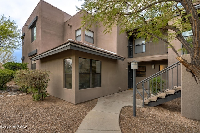 5855 N Kolb Rd Unit 1102, Tucson, AZ 85750 - back of house with stucco siding and a patio area
