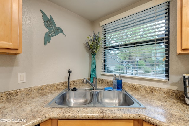 5855 N Kolb Rd Unit 1102, Tucson, AZ 85750 - kitchen view of a sink, light brown cabinetry, and light countertops