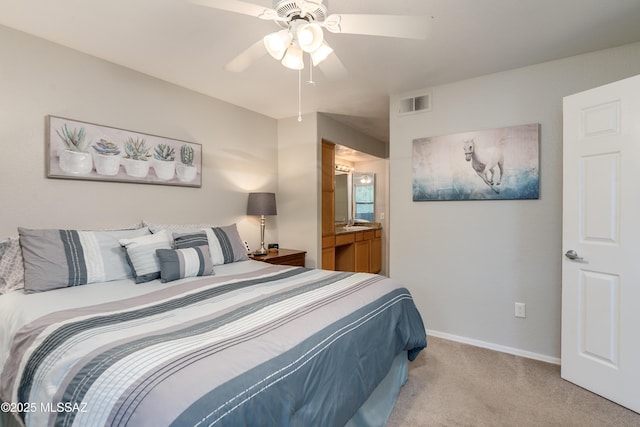 5855 N Kolb Rd Unit 1102, Tucson, AZ 85750 - bedroom featuring light colored carpet, baseboards, a ceiling fan, and ensuite bathroom