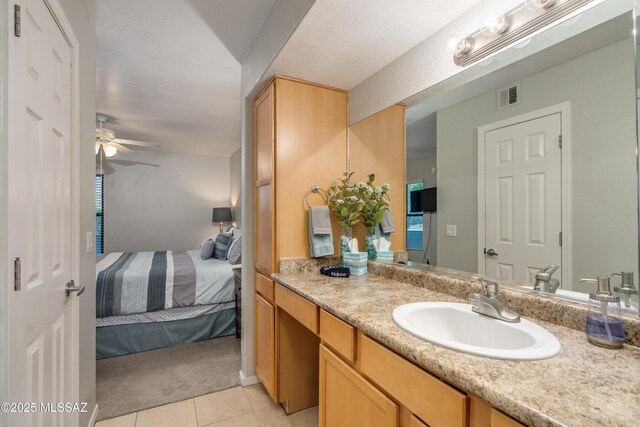 5855 N Kolb Rd Unit 1102, Tucson, AZ 85750 - ensuite bathroom featuring a ceiling fan, tile patterned flooring, and vanity