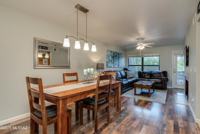 5855 N Kolb Rd Unit 1102, Tucson, AZ 85750 - dining area with dark wood-style flooring, ceiling fan, and baseboards