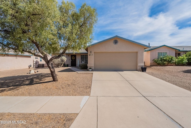 8912 E Desert Aire St, Tucson, AZ 85730 - single story home featuring a garage, stucco siding, concrete driveway, and cooling unit