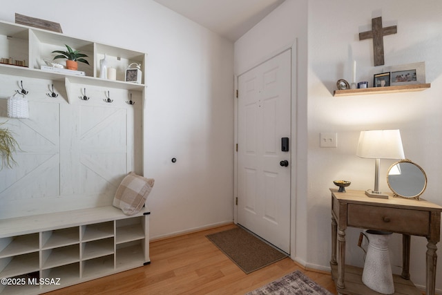 8912 E Desert Aire St, Tucson, AZ 85730 - mudroom featuring wood finished floors and baseboards