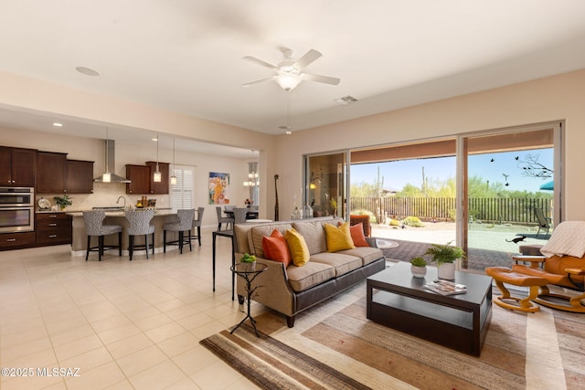 6719 W Kaibab Trl, Marana, AZ 85658 - living area featuring healthy amount of natural light, ceiling fan, and light tile patterned flooring