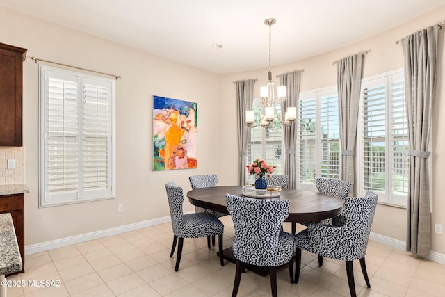 6719 W Kaibab Trl, Marana, AZ 85658 - dining area with a chandelier, baseboards, and light tile patterned floors