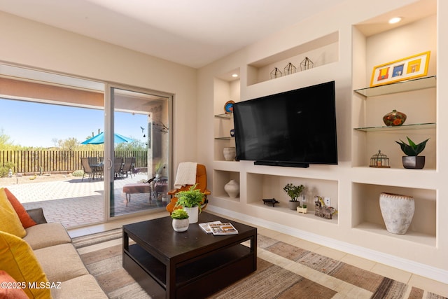 6719 W Kaibab Trl, Marana, AZ 85658 - living area with built in shelves, tile patterned floors, and recessed lighting