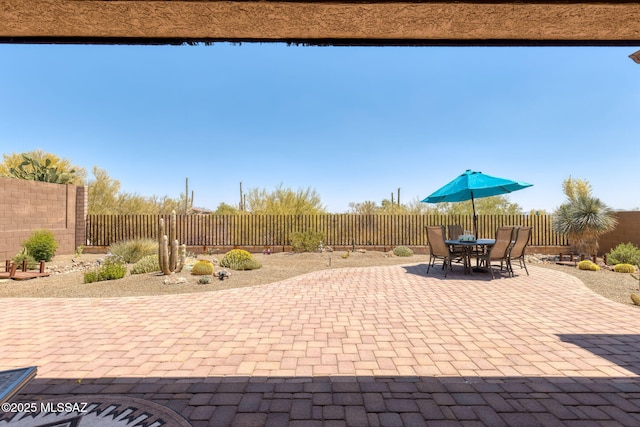 6719 W Kaibab Trl, Marana, AZ 85658 - fenced backyard with a patio and outdoor dining space