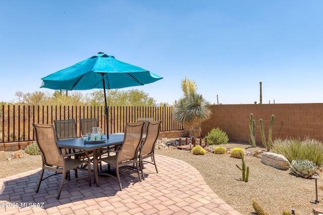 6719 W Kaibab Trl, Marana, AZ 85658 - fenced backyard with outdoor dining area and a patio