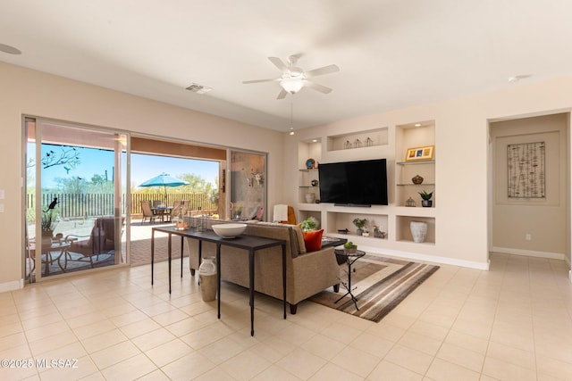 6719 W Kaibab Trl, Marana, AZ 85658 - living room featuring a ceiling fan, baseboards, built in features, and light tile patterned floors