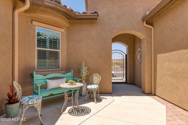 6719 W Kaibab Trl, Marana, AZ 85658 - doorway to property featuring stucco siding, a gate, and a patio area