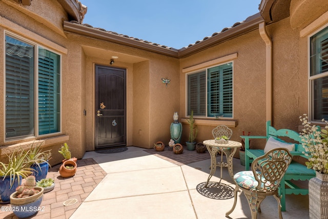 6719 W Kaibab Trl, Marana, AZ 85658 - doorway to property with a patio area and stucco siding