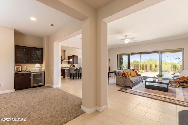 6719 W Kaibab Trl, Marana, AZ 85658 - living area featuring wine cooler, bar with sink, light tile patterned floors, baseboards, and recessed lighting