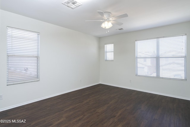 6775 S Aquiline Dr, Tucson, AZ 85756 - spare room featuring ceiling fan and dark wood-style flooring