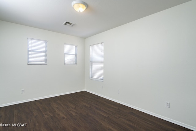 6775 S Aquiline Dr, Tucson, AZ 85756 - unfurnished room featuring dark wood-style flooring and baseboards