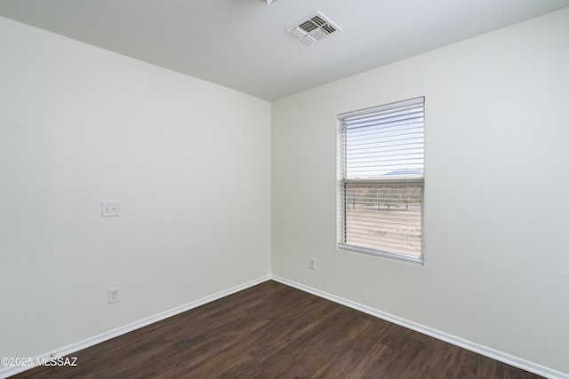 6775 S Aquiline Dr, Tucson, AZ 85756 - unfurnished room with dark wood-style floors and baseboards