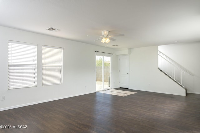 6775 S Aquiline Dr, Tucson, AZ 85756 - empty room featuring ceiling fan, stairway, and wood finished floors