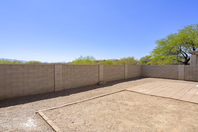 6775 S Aquiline Dr, Tucson, AZ 85756 - fenced backyard with a patio area