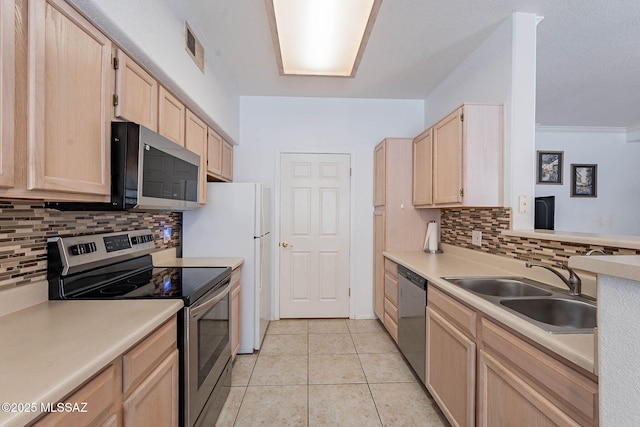 7050 E Sunrise Dr Unit 12106, Tucson, AZ 85750 - kitchen featuring appliances with stainless steel finishes, light brown cabinets, a sink, and backsplash
