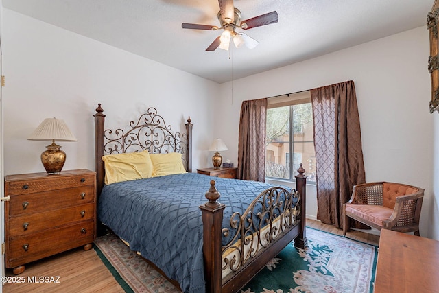 7050 E Sunrise Dr Unit 12106, Tucson, AZ 85750 - bedroom with light wood finished floors and ceiling fan