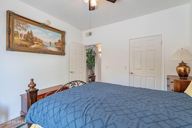 7050 E Sunrise Dr Unit 12106, Tucson, AZ 85750 - bedroom with a ceiling fan, wood finished floors, and baseboards