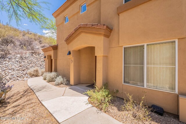 7050 E Sunrise Dr Unit 12106, Tucson, AZ 85750 - doorway to property with stucco siding