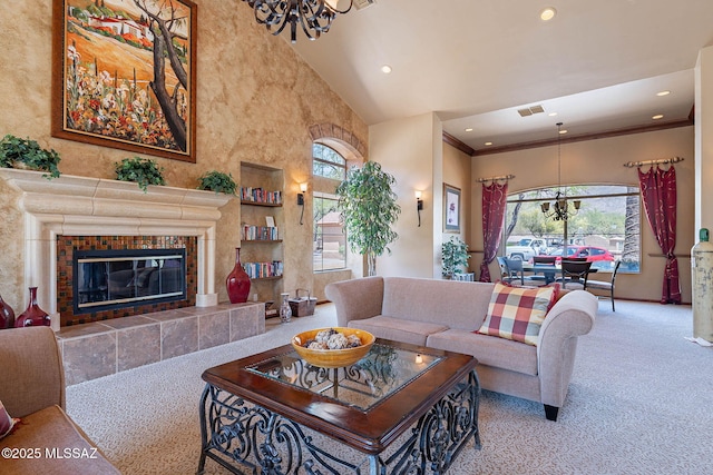 7050 E Sunrise Dr Unit 12106, Tucson, AZ 85750 - carpeted living room featuring a high ceiling, healthy amount of natural light, recessed lighting, a fireplace, and a chandelier
