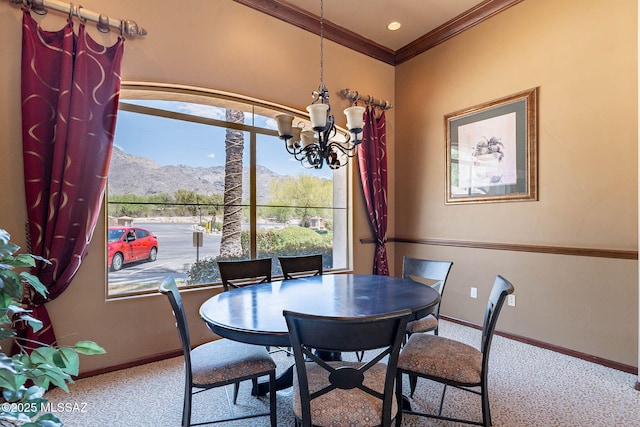 7050 E Sunrise Dr Unit 12106, Tucson, AZ 85750 - dining space with a mountain view, a chandelier, carpet, baseboards, and crown molding
