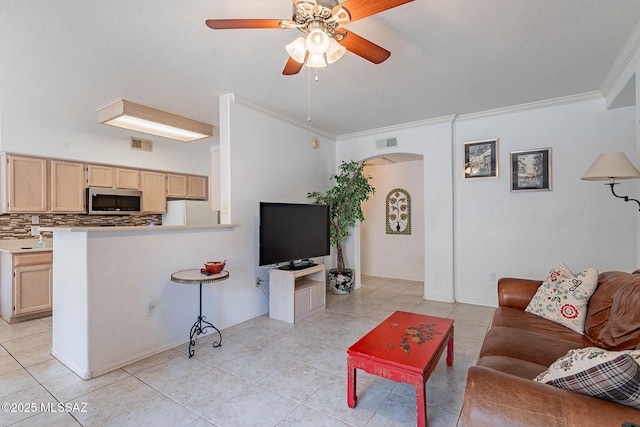 7050 E Sunrise Dr Unit 12106, Tucson, AZ 85750 - living room with ornamental molding, arched walkways, light tile patterned flooring, and ceiling fan