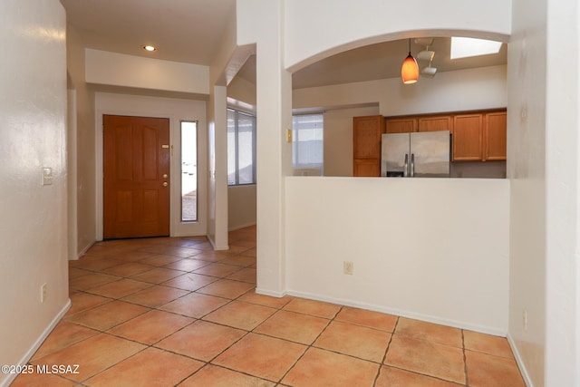 5426 N Willow Thicket Way, Tucson, AZ 85704 - foyer featuring arched walkways, light tile patterned flooring, baseboards, and recessed lighting