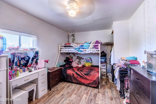 bedroom with light wood-style floors and ceiling fan