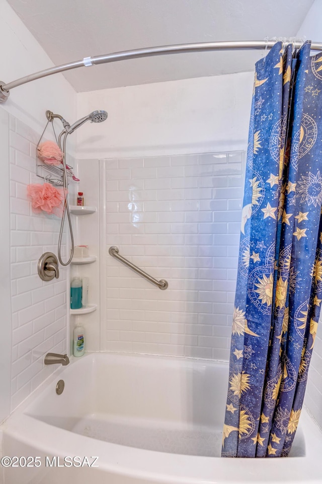 bathroom featuring shower / bathtub combination with curtain